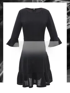 Detail of a black bodycon dress with elegant ruffle sleeves and back invisible zipper closure