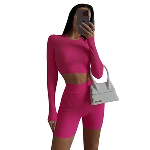 Women's rose pink ribbed knit two-piece set featuring long sleeve crop top and shorts