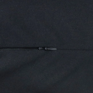 Close-up of invisible back zipper on black textured dress with high quality fabric