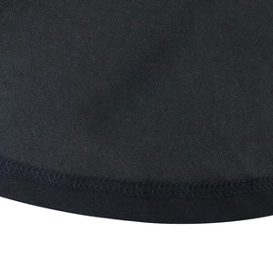 Close-up of high-quality stitching and soft knitted texture on black flared sleeve dress