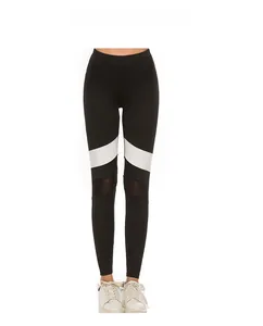 Detail showing color block splicing and breathable mesh panels on black yoga leggings