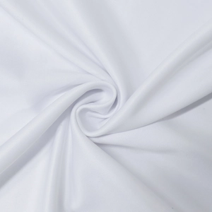Close-up of white ethnic dress fabric showing delicate mesh texture and soft material
