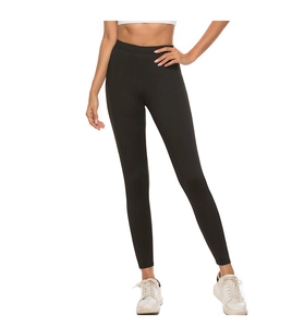 Detail showing the elastic waistband and letter print on black high-waisted yoga pants