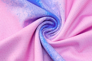 Macro shot of breathable pink and blue gradient mesh fabric with spiral texture