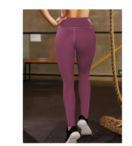 Close-up of high-waist yoga pants with V-shaped back seam and side pockets in dark purple