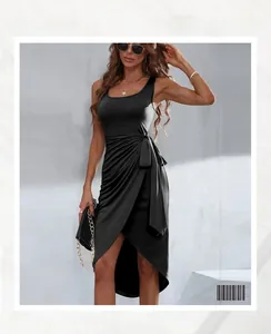 Detail of black ruched sleeveless dress with side tie waist and asymmetrical slit hem