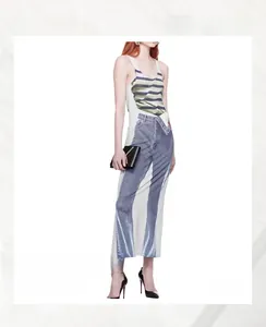 Detail of trompe-l'oeil digital print on maxi dress showing faux denim and stripes