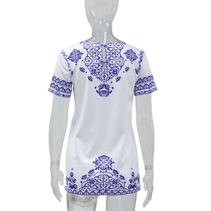 Back view of white round neck T-shirt with blue ethnic print on a white background