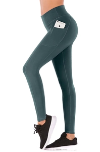 Detail showing side pocket of dark green high waist yoga pants with phone inserted