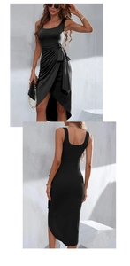 Detail of a black sleeveless wrap dress featuring a side tie-up waist and elegant midi-cut