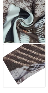 Detail of digital python print fabric with reinforced double-stitch sewing craftsmanship