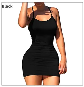 Detailed view of the slim fit black mini dress with thin straps and elastic fabric