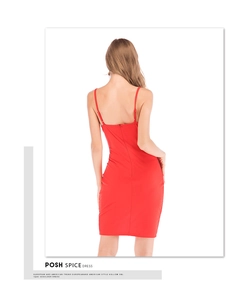 Close-up of the smooth red silky fabric and backless detail of this sexy V-neck dress