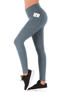 Detail of high waisted yoga leggings featuring functional side pockets for phone storage