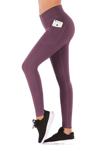 Close-up of high-waist purple yoga leggings featuring a functional side phone pocket