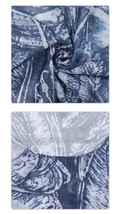 Detailed view of sheer mesh fabric with blue abstract print and reinforced hem stitching