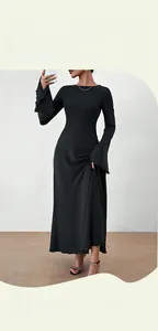 Detail of elegant black long-sleeve dress featuring dramatic bell sleeves and ribbed texture