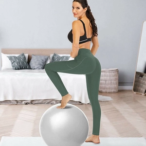 High-waisted dark green yoga leggings with side pockets and slimming tummy control fit