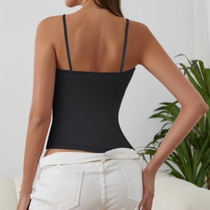 Slim fit black camisole with spaghetti straps showing back details in home setting