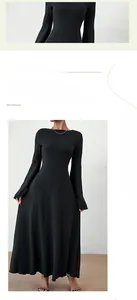 Detail of slim-fit black long-sleeve knit dress with flared sleeves and backless design