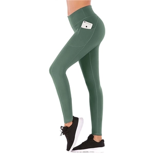 High-waisted dark green yoga leggings with functional side pockets and flattering fit