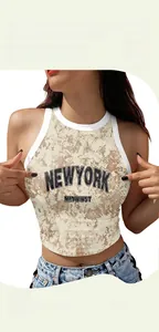 Detail of crop top with digital marble print and New York embroidery finish