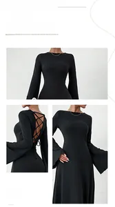 Close-up of elegant backless lace-up detail on this slimming black long-sleeved dress