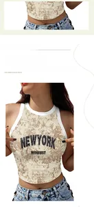 Detail of crop top with New York print, contrast trim, and camouflage texture