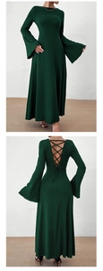 Detail of elegant dark green maxi dress featuring bell sleeves and cross tie back design