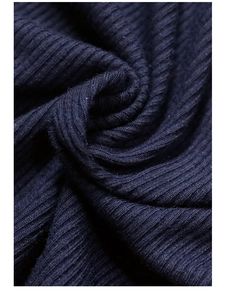 Detailed macro view of the premium navy blue ribbed knit fabric texture and softness