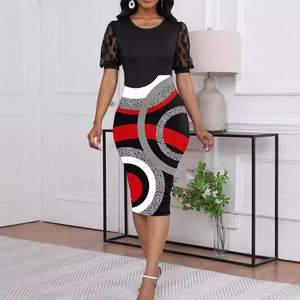 Detailed view of hollow lace puff sleeves and vibrant geometric print on a slim dress