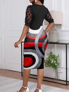 Elegant midi dress with mesh puff sleeves and geometric print patchwork design