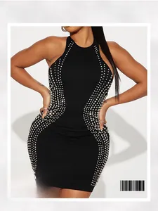 Detail of black bodycon dress featuring halter neck and silver rhinestone wave pattern