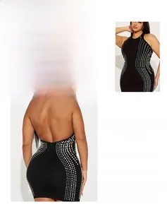 Detail of black halter bodycon mini dress with silver dotted pattern and open back design