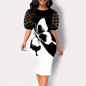 Detail of the butterfly print and sheer polka dot mesh puff sleeves on the slim dress
