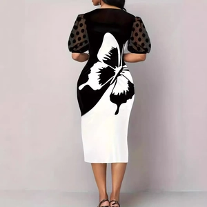 Detail of the butterfly print on the back with black mesh polka dot puff sleeves