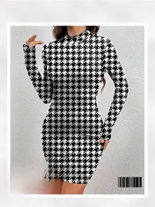 Close-up of the black and white houndstooth pattern on a slim-fit knitted mini dress