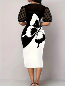 Slim fit midi dress with butterfly print, mesh polka dot puff sleeves, and bicolor design