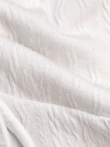 Top bianco a lupetto senza maniche da donna in maglia strutturata di alta qualità