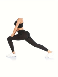 Side view of black high-waisted seamless yoga set featuring lift leggings and sports bra