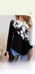 Détail d'un t-shirt à manches longues avec imprimé floral 3D et ourlet asymétrique