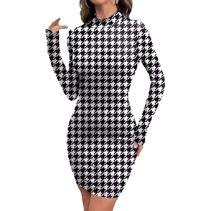 Slim fit long sleeve turtleneck dress featuring a classic black and white houndstooth print
