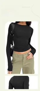 Front and back detail view of a slim fit black long sleeve crewneck top for women