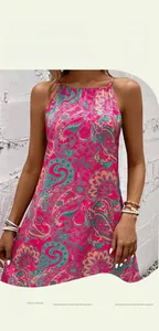 Close-up of sleeveless summer dress featuring vibrant pink paisley and floral patterns