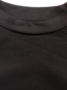 Slim fit black long sleeve crew neck knit shirt for women showing detailed neckline texture