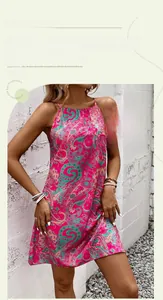 Detail of pink and cyan paisley print on lightweight halter neck summer mini dress
