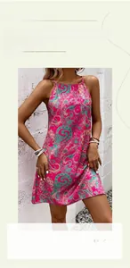 Detail view of pink paisley bohemian halter dress with vibrant ethnic pattern and soft fabric
