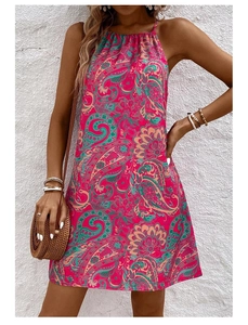 Close-up of pink Paisley print sleeveless dress with halter neck for summer beach