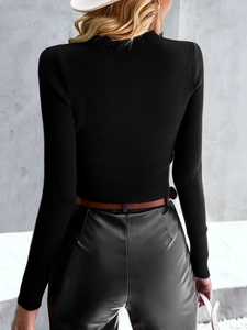 Back view of a slim black ribbed knit sweater with irregular hollow-out details
