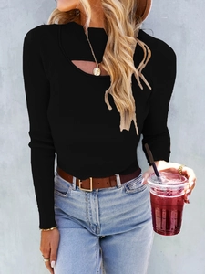 Detail of black ribbed knit sweater featuring a stylish oval cut-out at the neckline